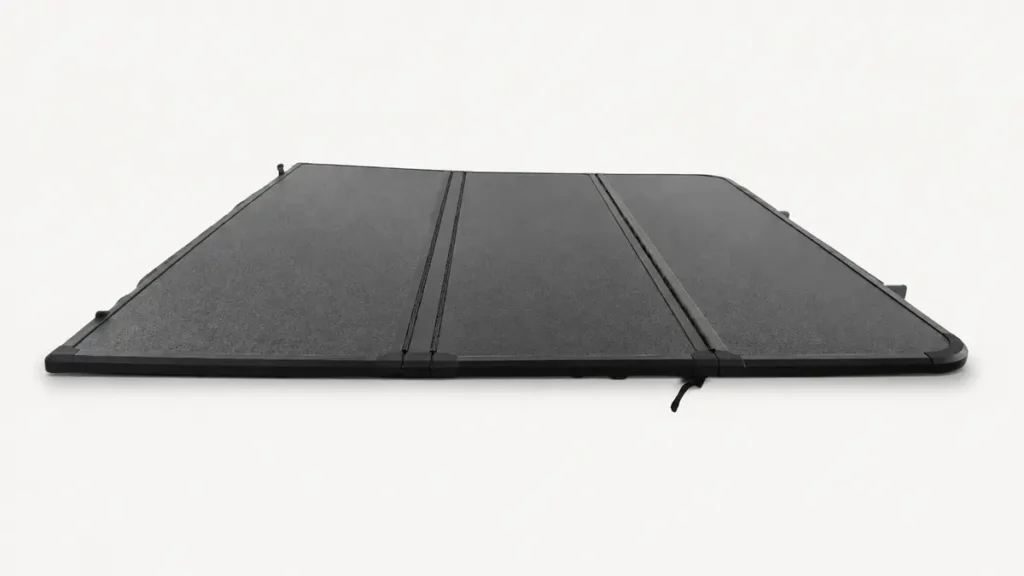 Black roll-up tonneau cover for pickup truck bed