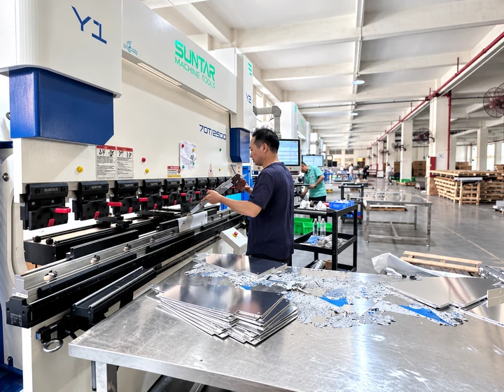 Operator bending aluminum panels with a press brake