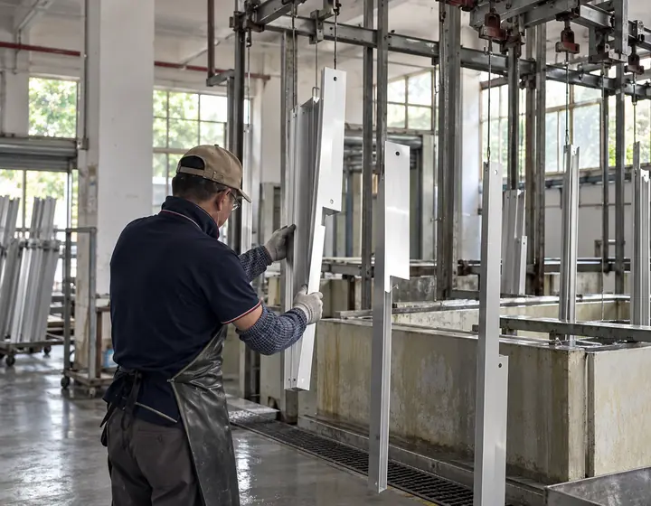 Aluminum parts hanging in the shared surface pretreatment area