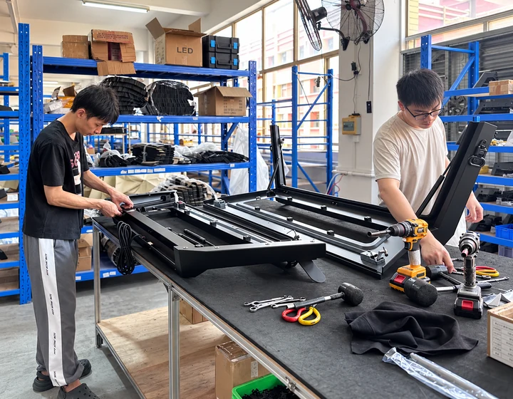 Quality inspector checking an assembled canopy frame