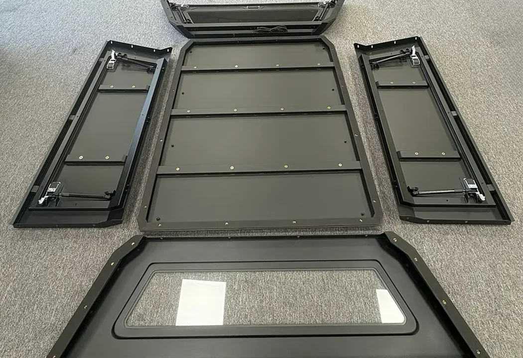 Modular truck canopy sections laid out before assembly