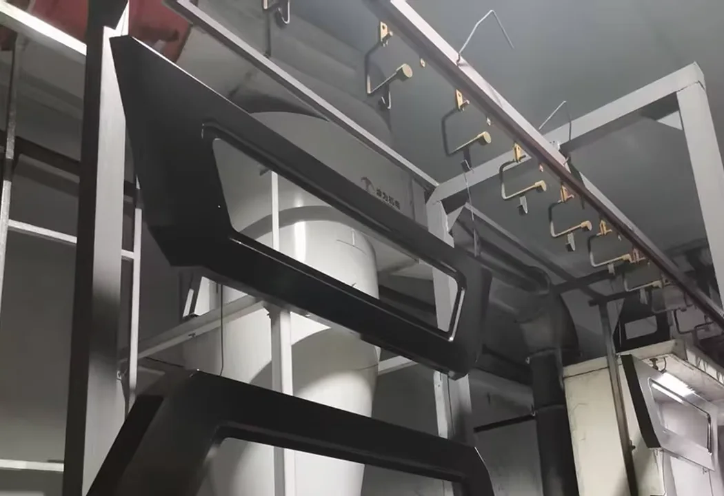 Powder coated canopy frame components on a production rack